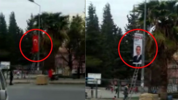 Türk bayrağını indirip AKP afişi astılar!
