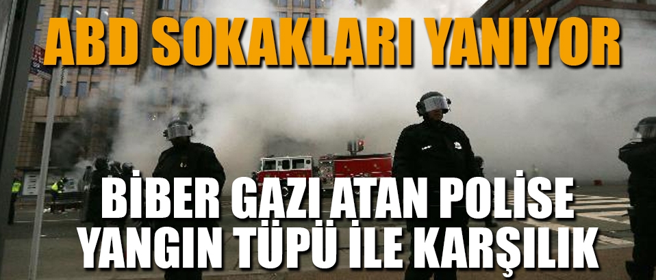 ABD'de yanıyor: Biber gazı atan polise yangın tüpü ile karşılık verildi