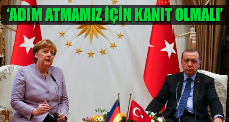 Merkel'den Saray'a başkanlık uyarısı