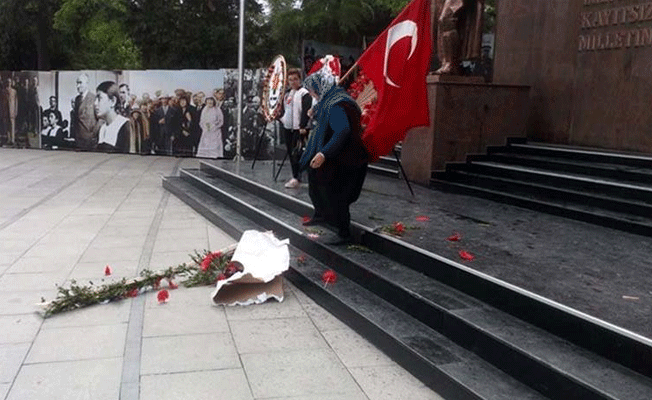 Çelenkleri parçalayan kadın serbest bırakıldı