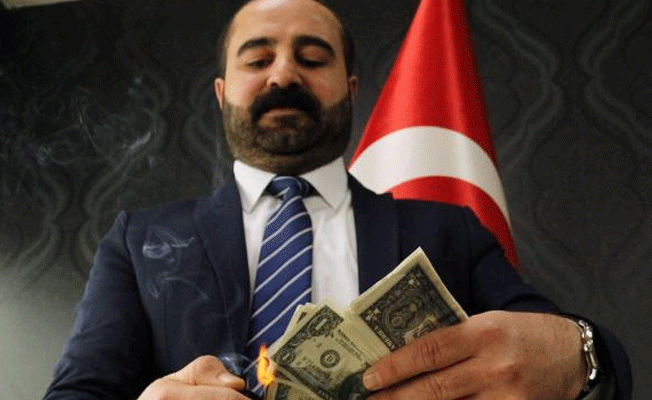 Doların yükselmesine 100 dolar yakarak tepki gösterdi