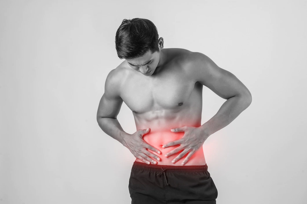 young-handsome-muscular-man-has-abdominal-pain-isolated-white-background-1150-2938.webp