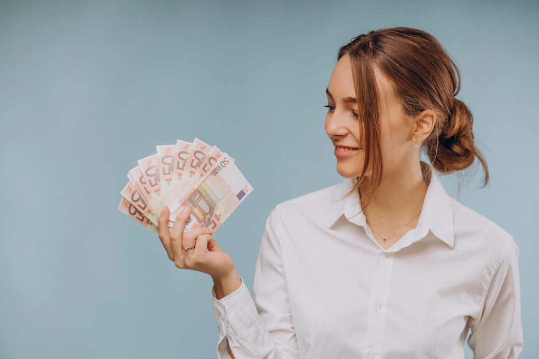 woman-holding-euro-banknotes-1303-29763.webp