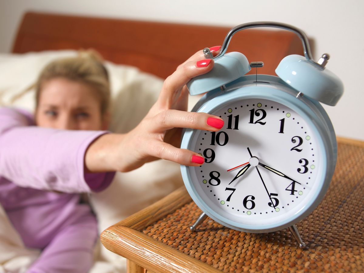 0-young-woman-turning-off-alarm.jpg