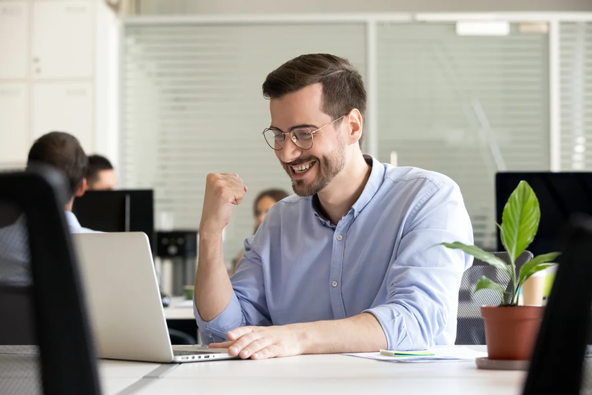 young-professional-man-looking-excited-at-his-desk-because-he-s-confident-that-he-s-found-a-job-he-s-passionate-about.webp