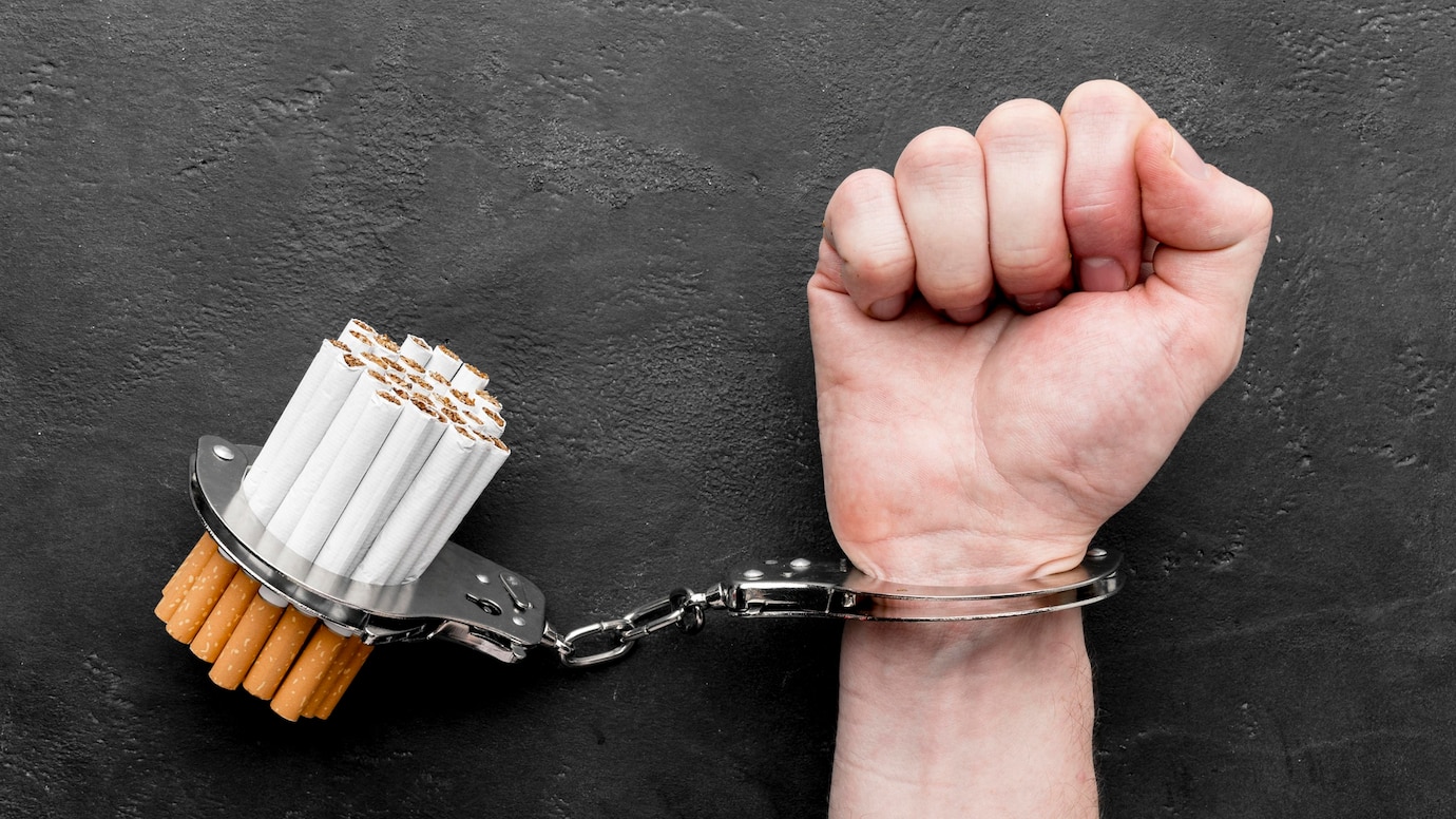 top-view-hand-with-handcuffed-cigarettes-23-2148585932.jpg