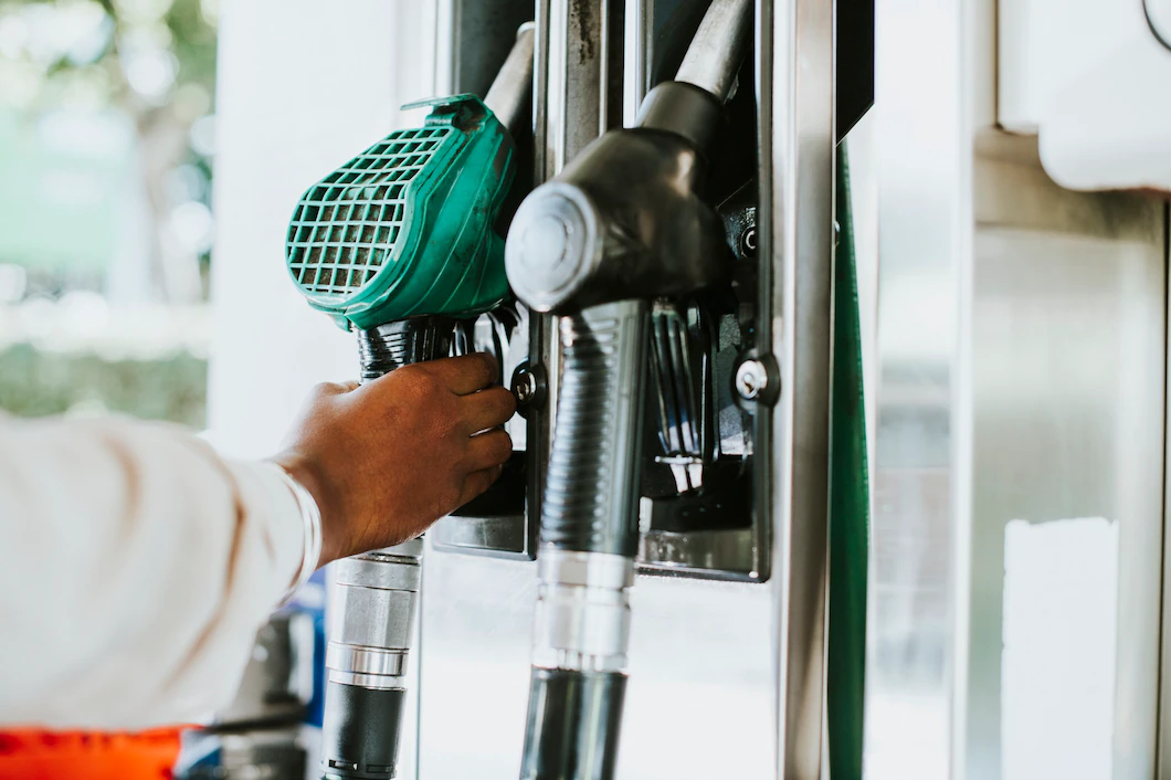 man-grabbing-fuel-nozzle-refuel-his-vehicle-53876-144803.webp