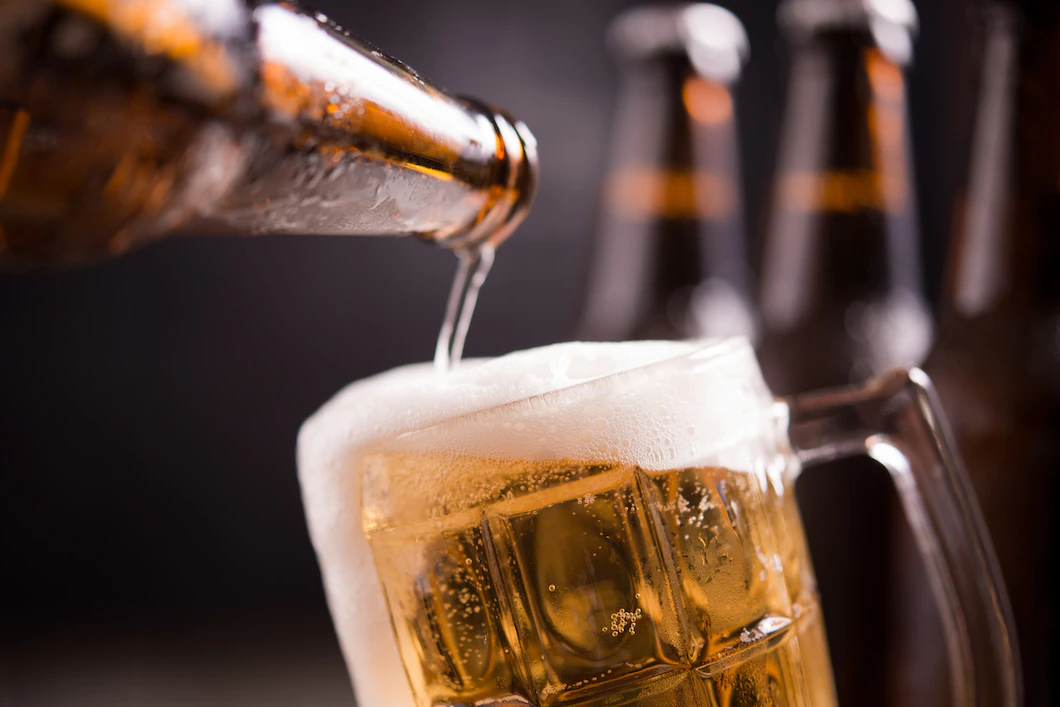 glass-bottles-beer-with-glass-ice-dark-background-1150-8901.webp