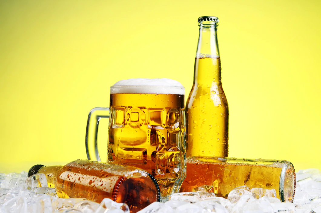 glass-beer-with-foam-yellow-background-144627-6844.webp