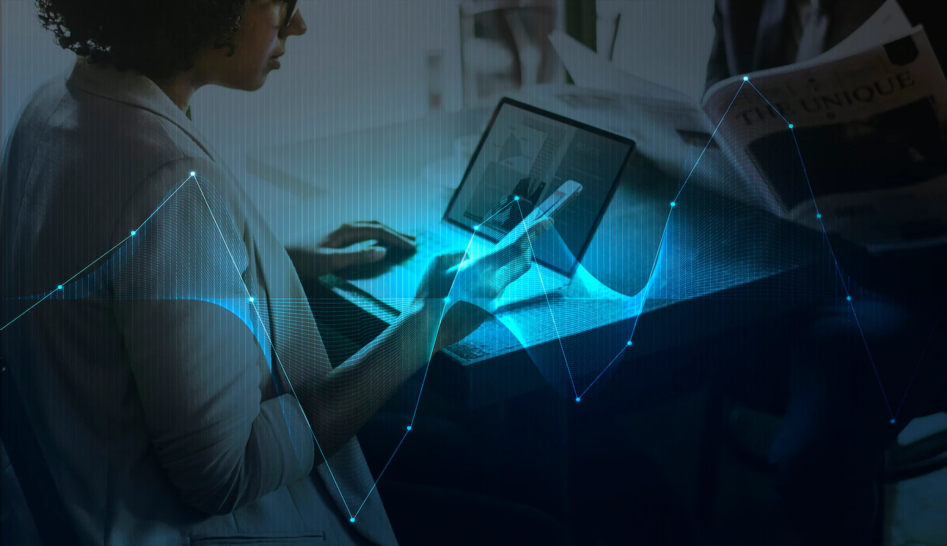 businesswoman-networking-using-digital-devices-53876-101875.webp