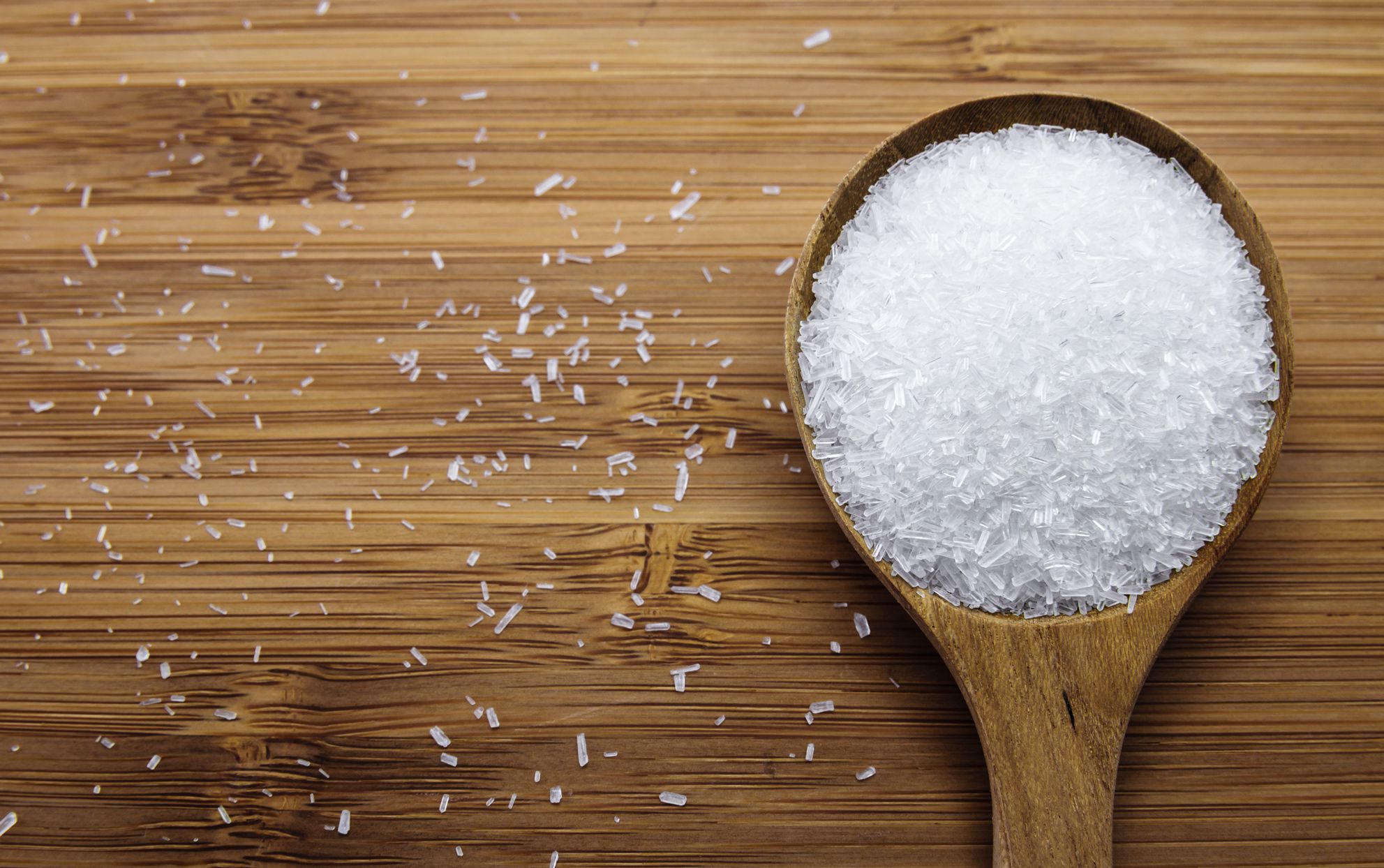 msg-with-spoon-spilled-on-wooden-table-cdcc9b8e2a1f40309fefcd78c56958aa.jpg
