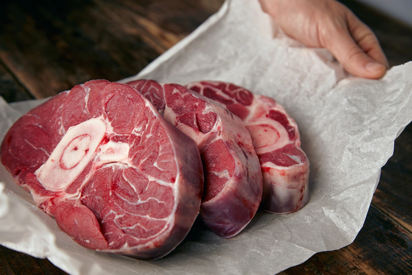 closeup-three-cosher-meat-steaks-with-bone-dinner-346278-545.webp