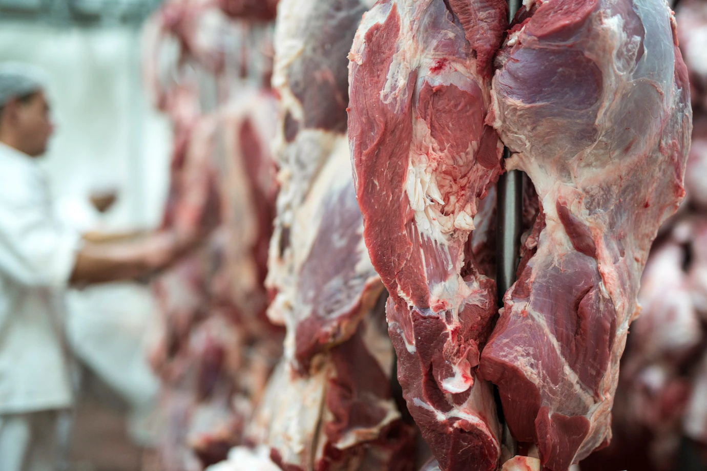 fresh-red-meet-butchery-worker-working-background-342744-662.webp