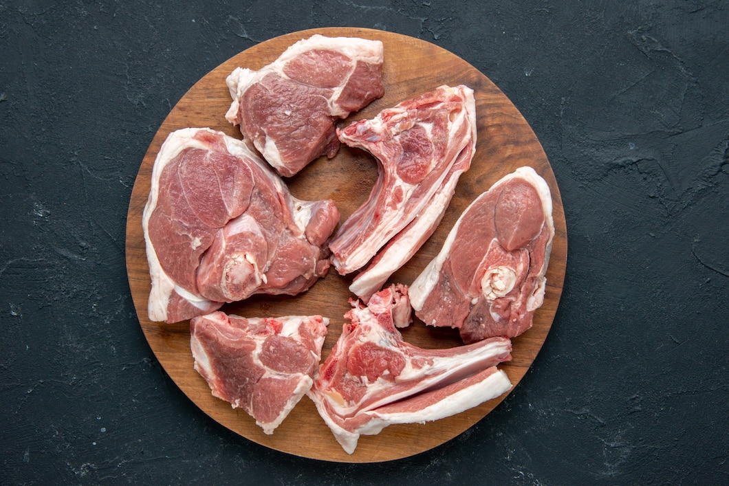 top-view-fresh-meat-slices-raw-meat-round-wooden-desk-dark-food-freshness-animal-cow-meal-food-kitchen-140725-145178.jpg