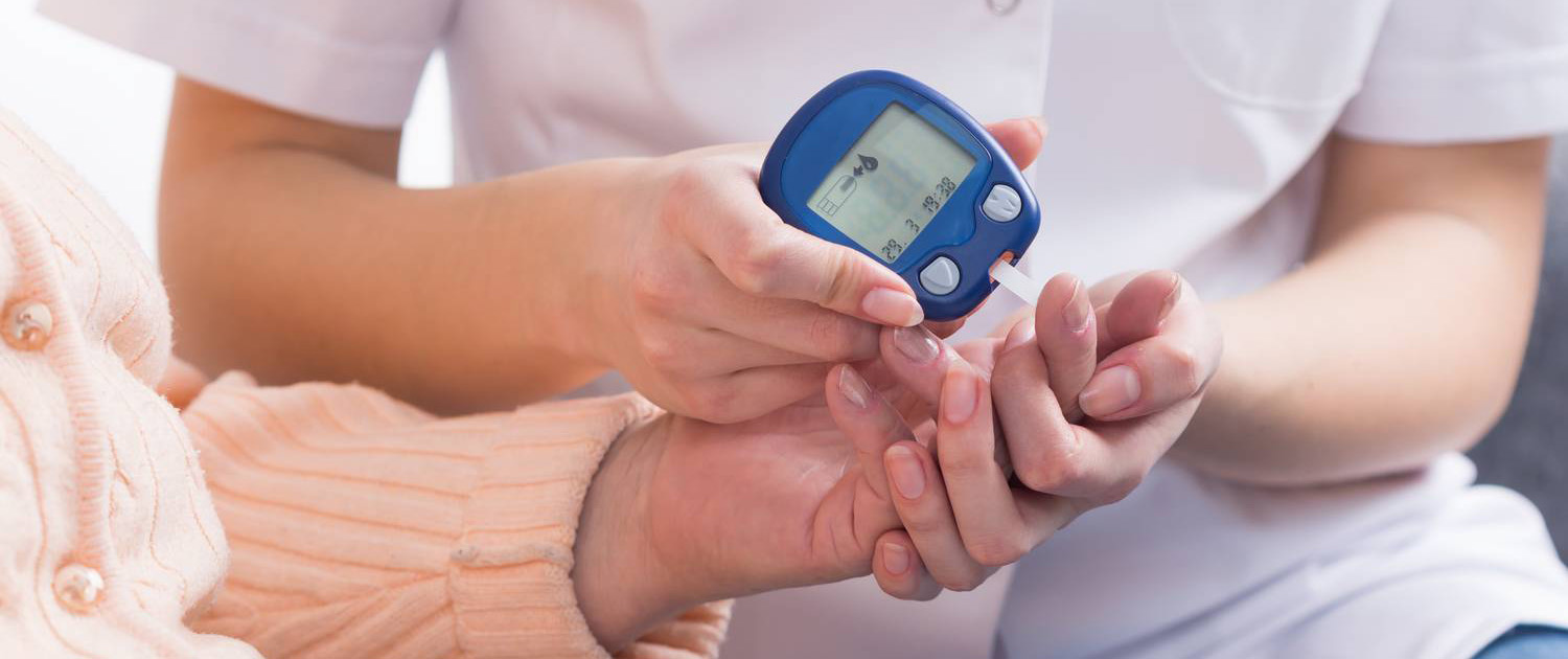 nurse-checking-blood-sugar-level-ppkmbw7-result-1.jpg