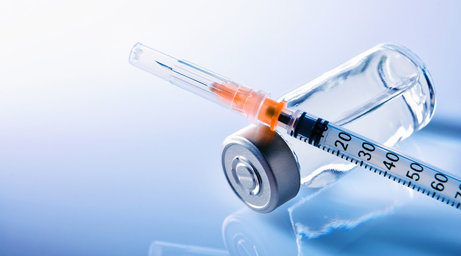 vaccine-vial-and-syringe-esser-kahn-science-advances.jpg