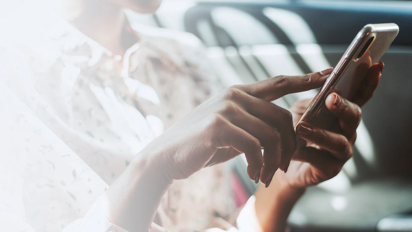 woman-using-phone-car-53876-103955.webp