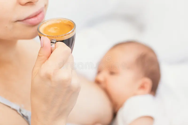 mother-drinking-coffee-breastfeeding-mother-drinking-coffee-breastfeeding-newborn-baby-breastfeeding-caffeine-326478844.webp