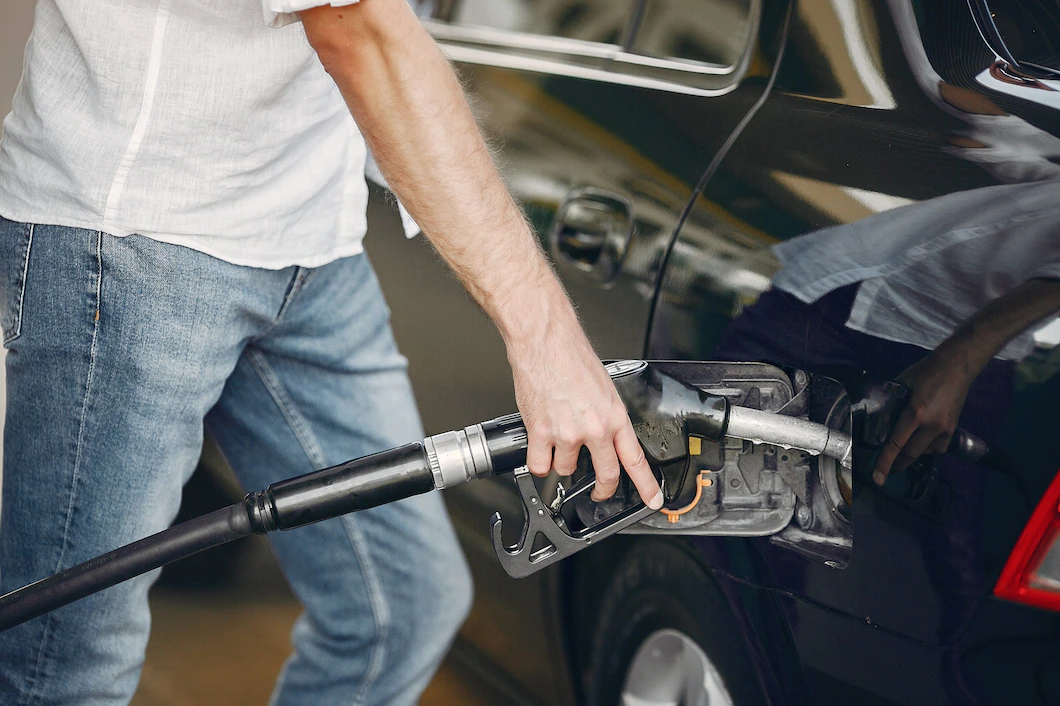 handsome-man-pours-gasoline-into-tank-car-1157-27211.webp
