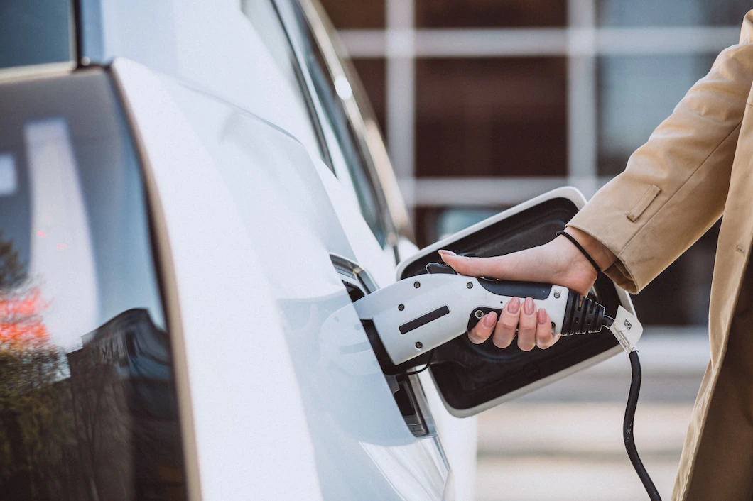 woman-charging-electro-car-electric-gas-station-1303-14656.webp