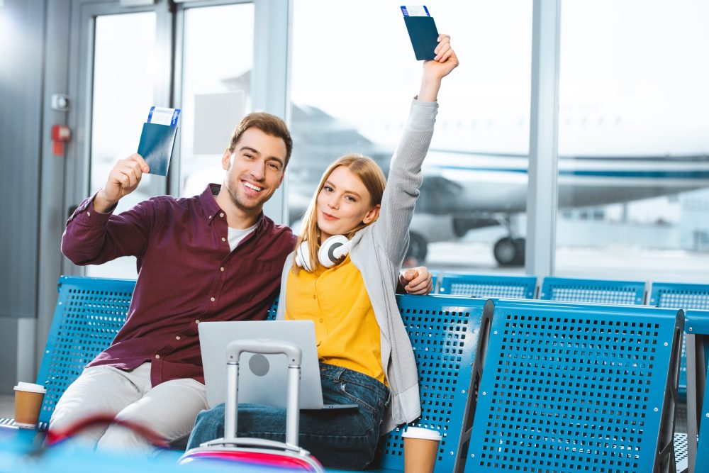 couple-holding-passport-e1695277420880.jpg